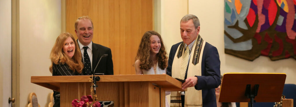 A young girl reading from a podium during a religious ceremony.